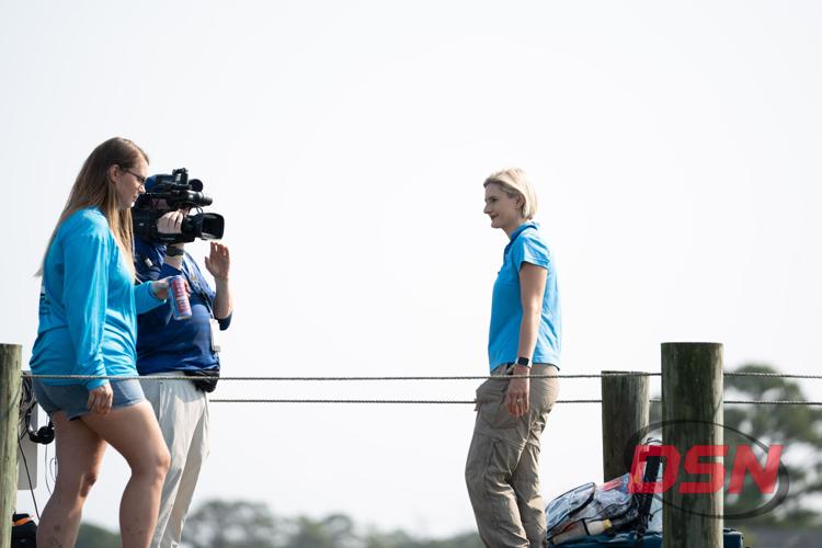 News crew filming an interview on the dock.jpg