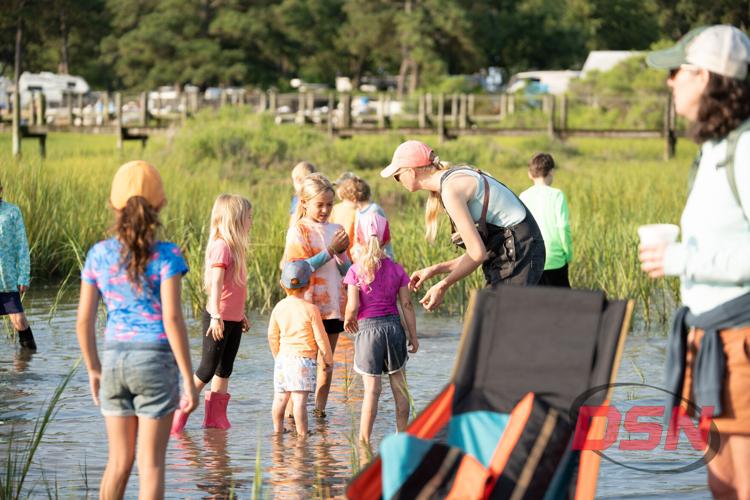 Muddy kids playing in the marsh water.jpg