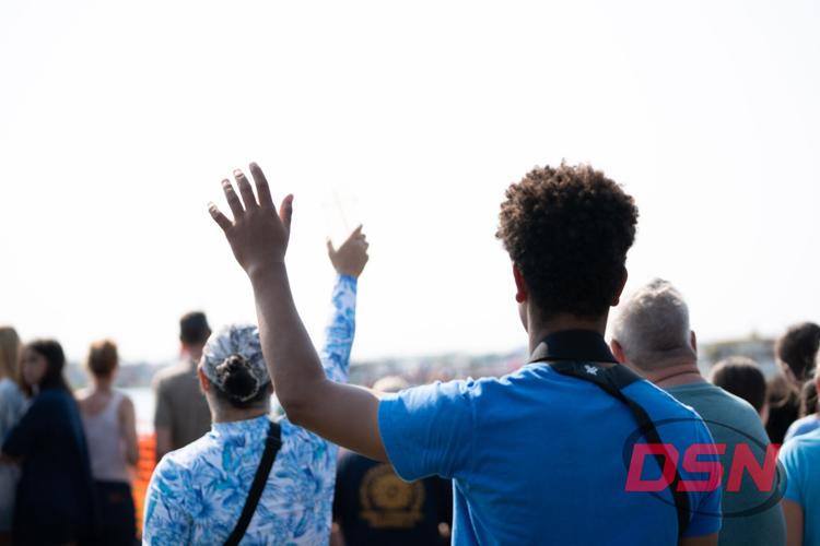 Man raising his hand and waving to the crowd.jpg