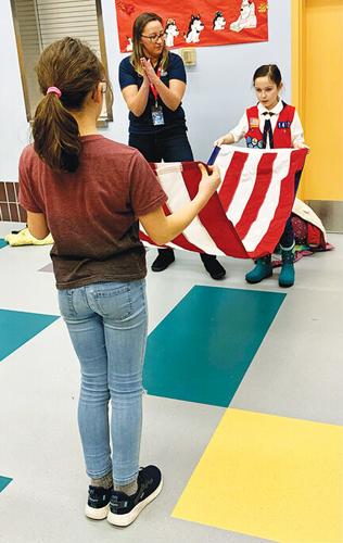 American Heritage Girls flag folding