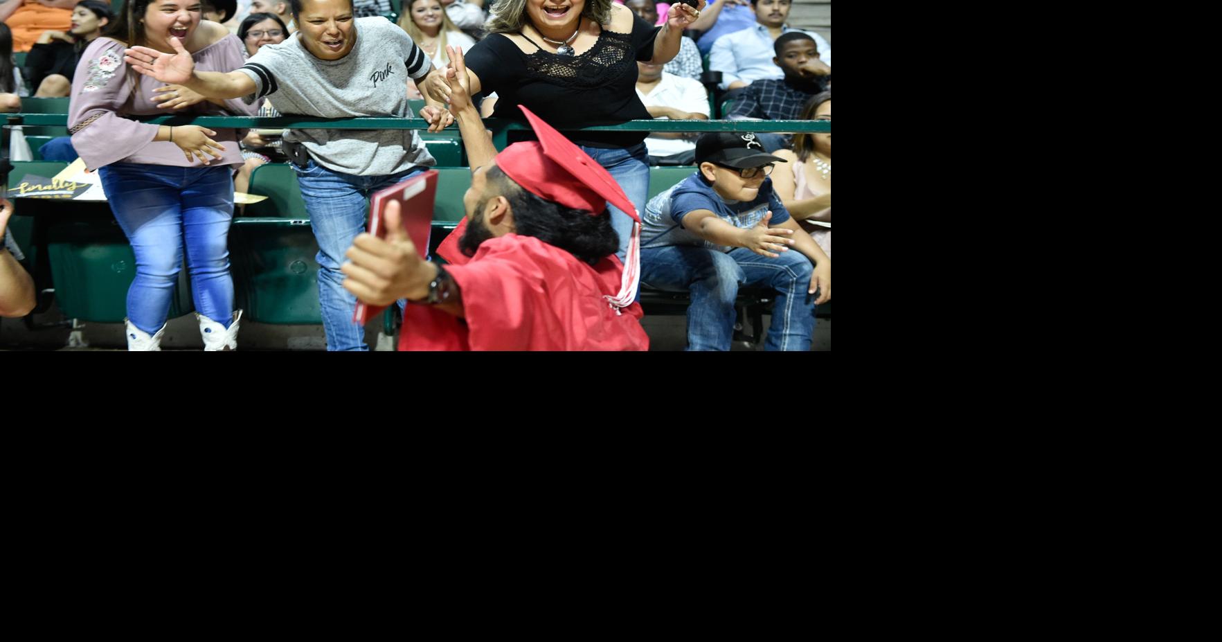 Families and friends congratulate graduating students during the Ryan