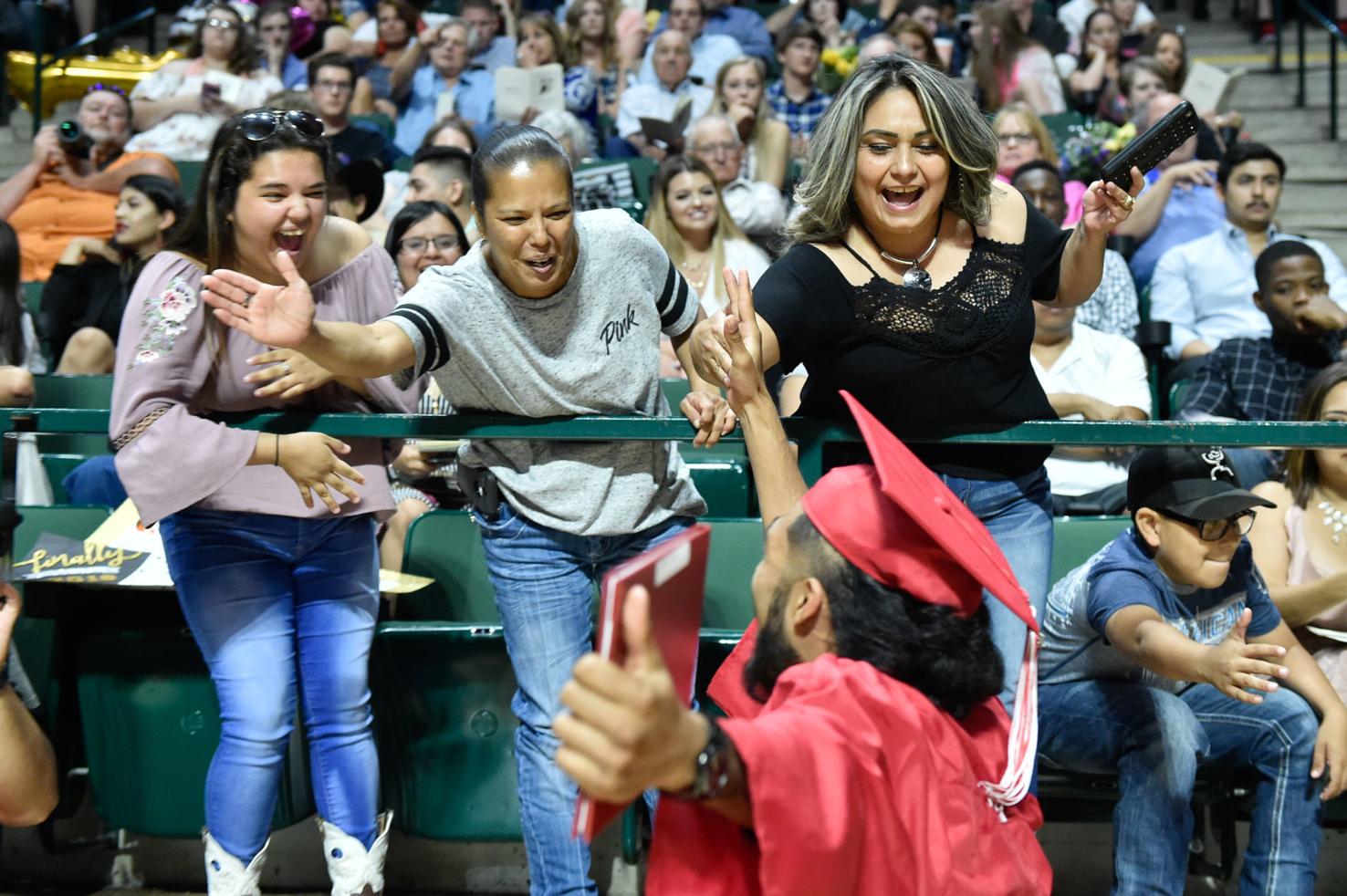 Families and friends congratulate graduating students during the Ryan