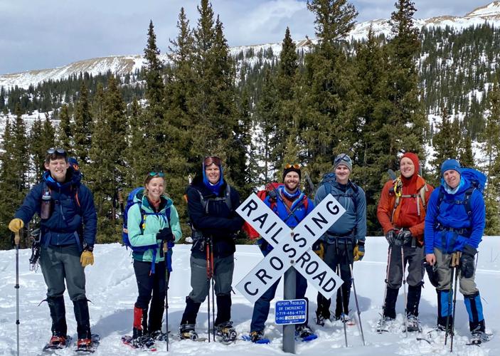 Colorado Mountain Club members with railroad crossing sign