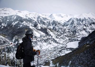 Spencer McKee looks down over the town of Telluride from nearby slopes of Telluride Ski Resort. Photo Credit: Stephen Martin.