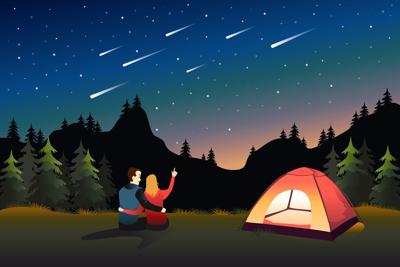 Couple Watching Meteor Shower While Camping Photo Credit: artisticco (iStock).