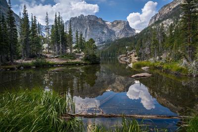 The Loch, a popular lake destination at Rocky Mountain National Park. Photo Credit: Christian Collins (Flickr).