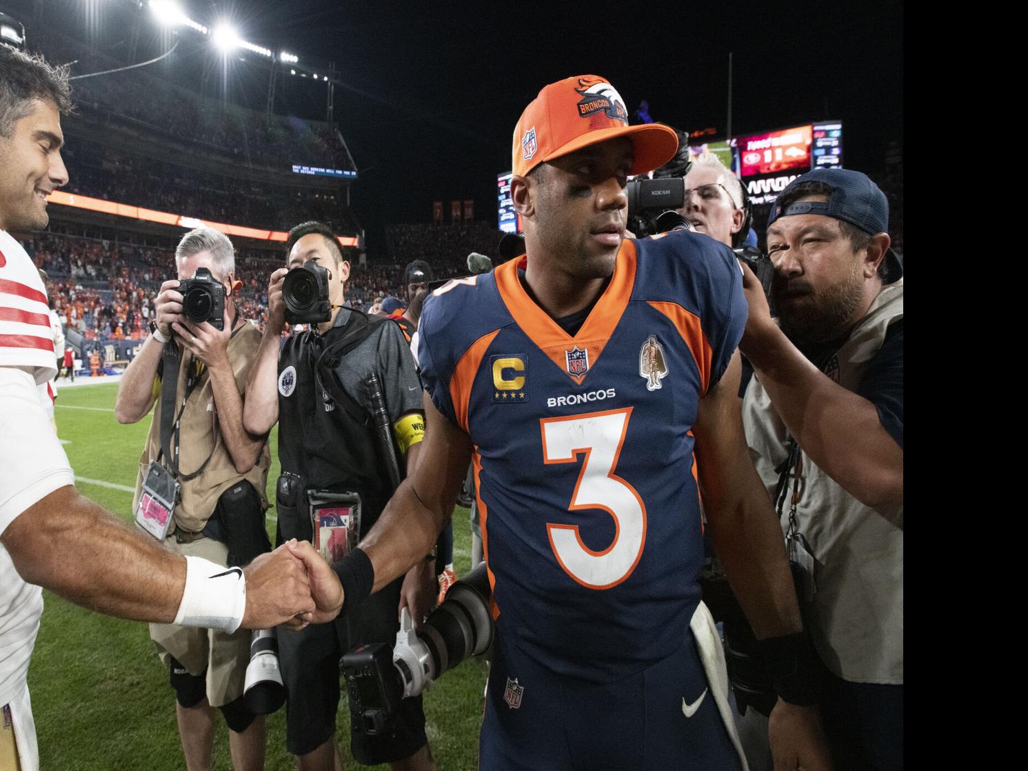 Broncos QB Russell Wilson fires first-pitch strike on Rockies' opening day