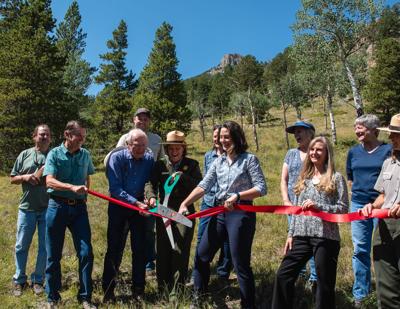 Vance Brand and family, along with Rocky Mountain National Park officials, celebrate the donation of Brand's land earlier this week. Photo Courtesy: Rocky Mountain National Park.