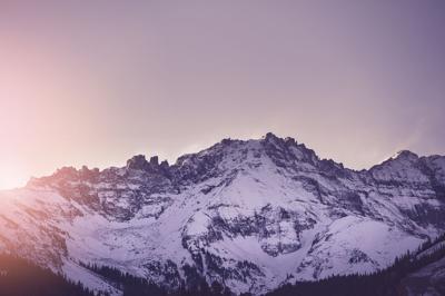 The sun rises over the San Juan mountains in Telluride, Colorado