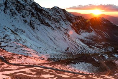 Snowy sunset viewed from Imogene Pass. Photo Credit: mattwicks (iStock).
