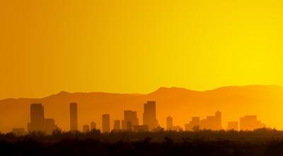 Denver Skyline Sunset Silhouette Photo Credit: SatoriPhoto (iStock).