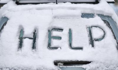 HELP distress message written on car in snow Photo Credit: donald_gruener (iStock).