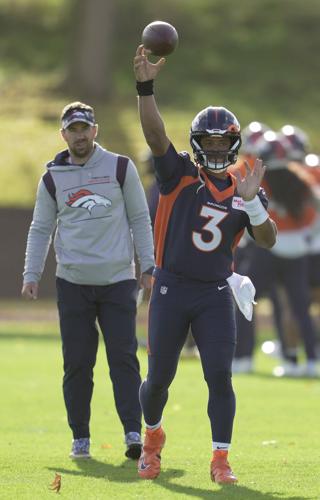 Broncos QB Russell Wilson fires first-pitch strike on Rockies' opening day