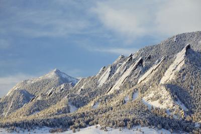 Winter Snow on the Boulder Colorado Flatirons Photo Credit: beklaus (iStock).