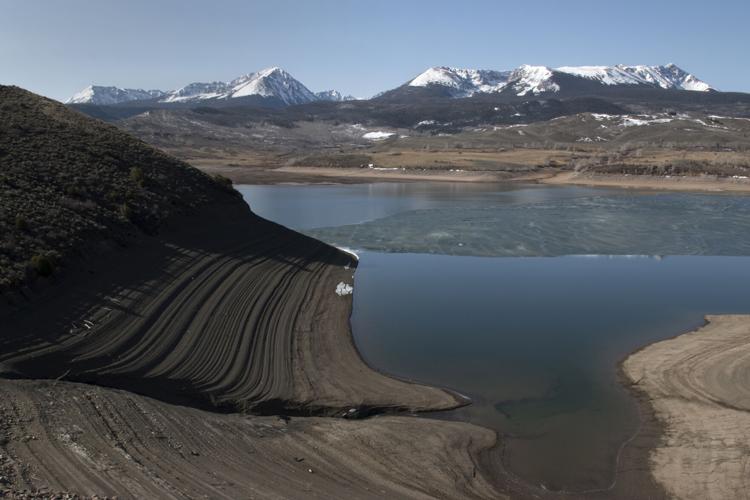 Low water in Colorado Rocky Mountain reservoir during drought