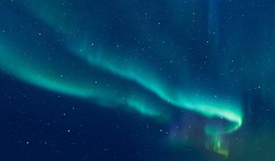 Northern lights in the night sky. Photo Credit: murat4art (iStock).