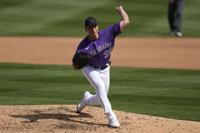 Colorado Rockies relief pitcher Brent Suter throws during a