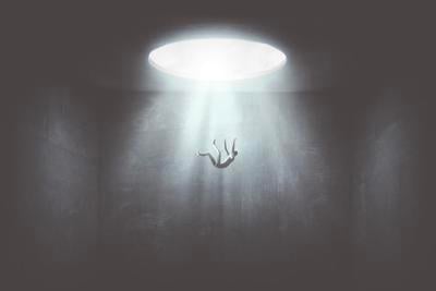 man falling down from a hole of light, surreal concept Photo Credit: francescoch (iStock).