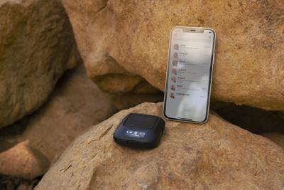 This image shows the Garmin Messenger device, along with the messaging feature of the companion app.