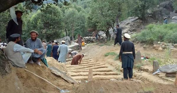 Afghan quake survivors dig graves with pickaxes as entire households wiped out