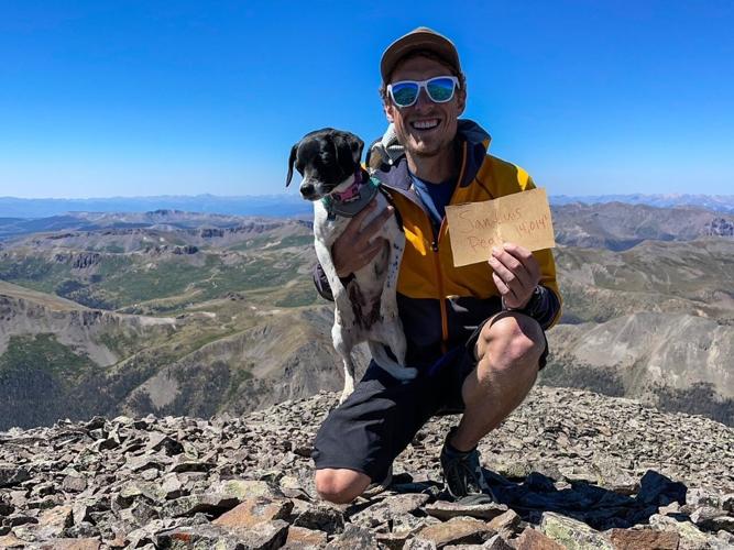 Spencer McKee and his dog, Nala, on top of San Luis Peak.