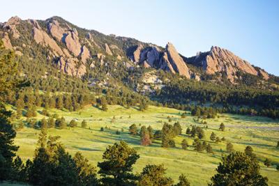 Sunrise over the Flatirons in Boulder, Colorado. Photo Credit: beklaus (iStock).