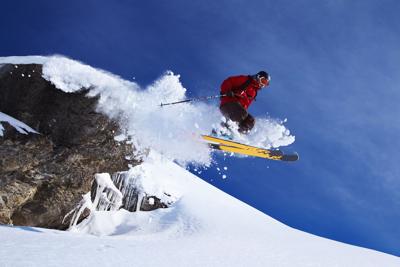 Skier jumping on snowy slope Photo: Jakob Helbig (iStock).