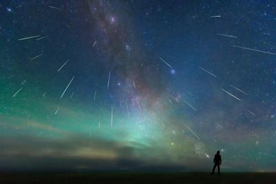 File photo of meteor shower. Photo Credit: bjdlzx (iStock).