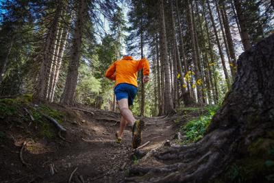 Man trail running in the forest, training for healthy lifestyle Photo Credit: piola666 (iStock)