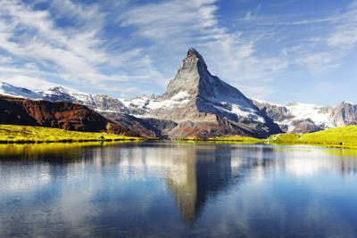 Picturesque view of Matterhorn peak and Stellisee lake in Swiss Alps Photo Credit: Smitt (iStock).