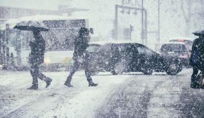 Pedestrians and traffic on a winter day Photo Credit: gremlin (iStock).