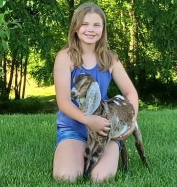 Kid gets a kid: Essay winner received baby doeling goat