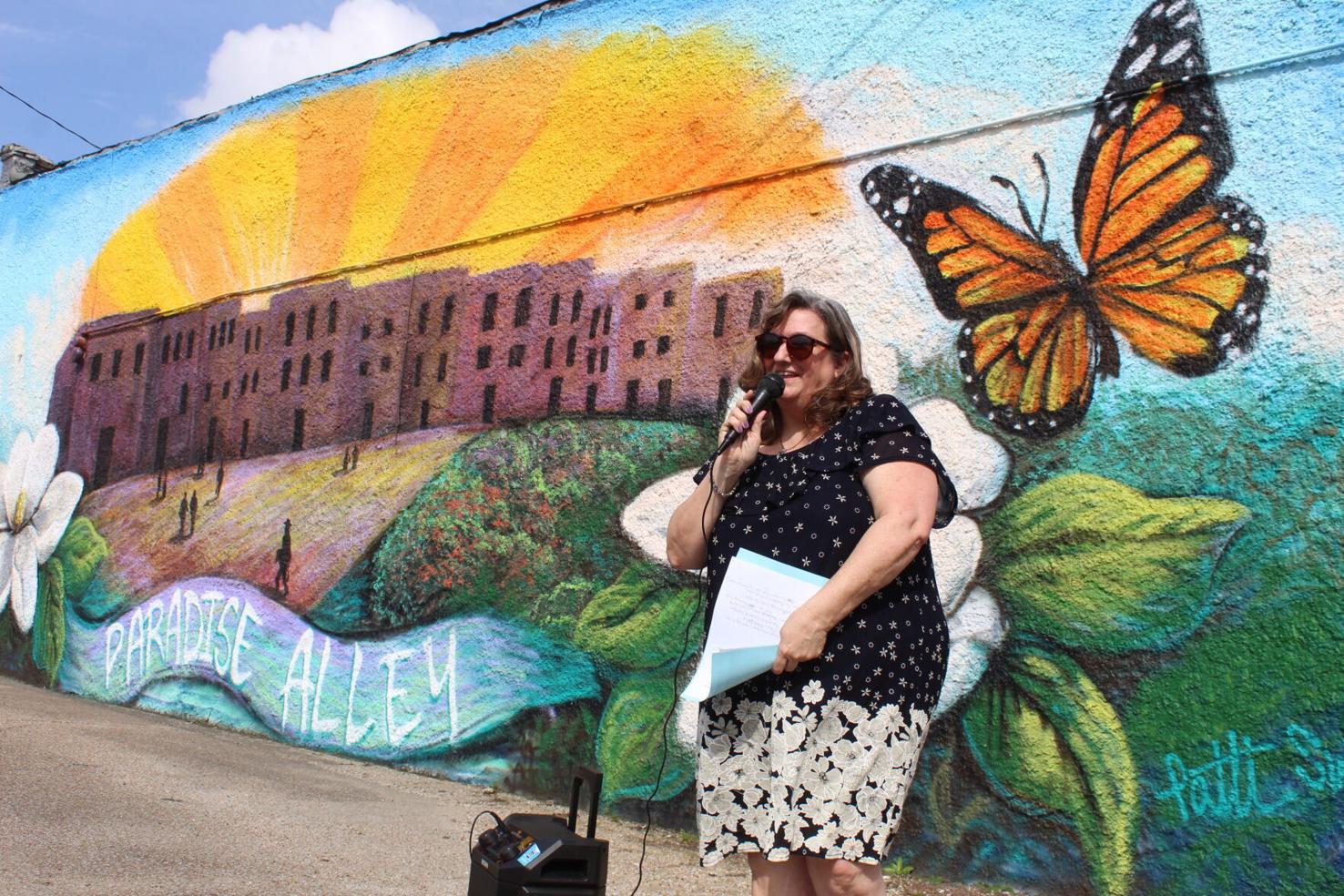 Tina Robbins in front of Aberdeen mural.
