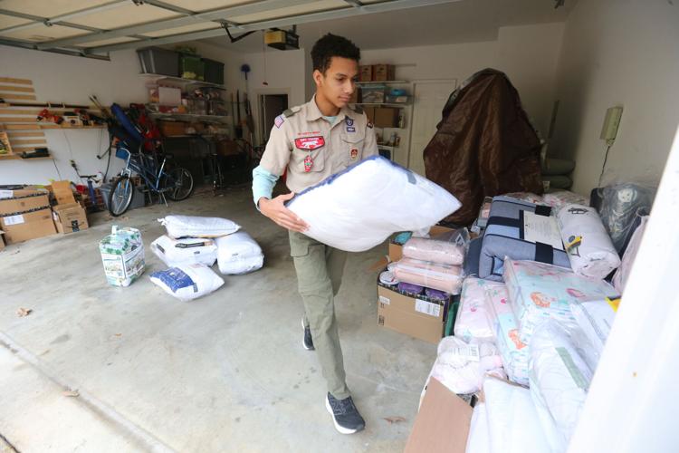 Tupelo Boy Scout collecting donations, building beds for children as