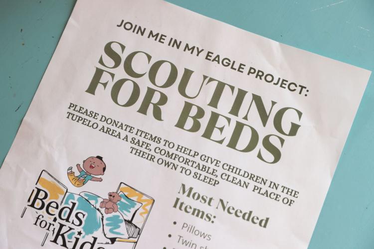 Tupelo Boy Scout collecting donations, building beds for children as