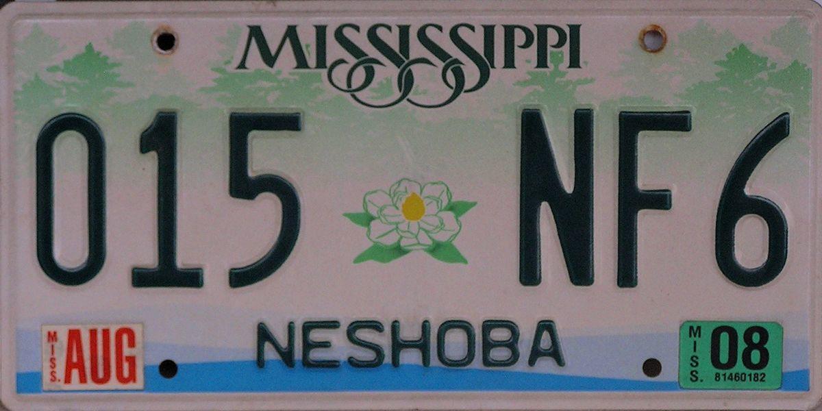 The story behind the dirt-colored, off-center, Canadian-made car tag