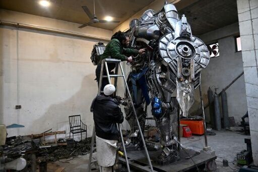 Pakistani artist Ehtisham Jadoon welding components for a large metal sculpture, showcasing his technical skill