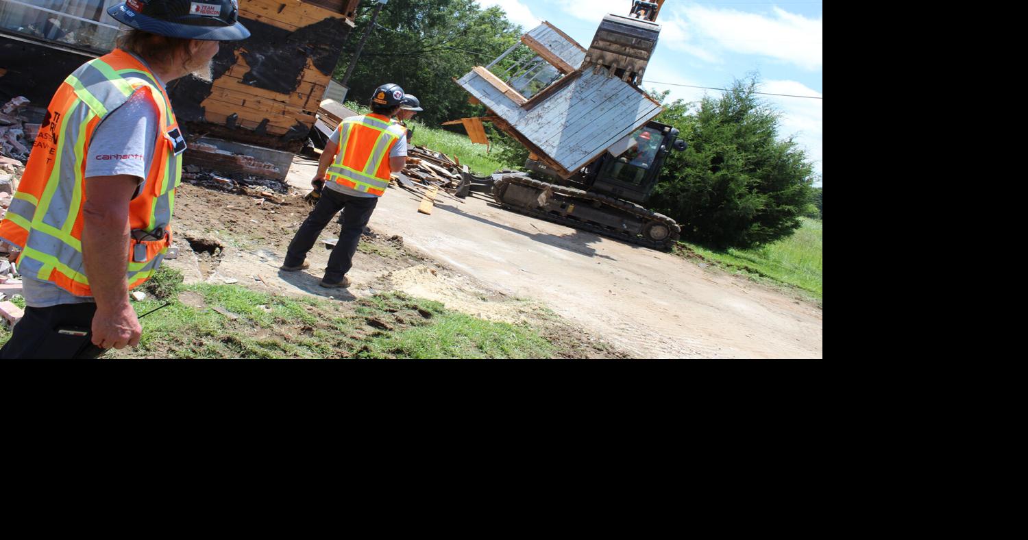 Team Rubicon volunteers work to demolish tornado-damaged homes