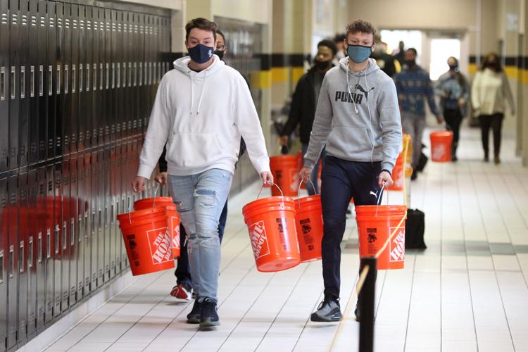 Home Depot Foundation delivers buckets of cleaning supplies to local