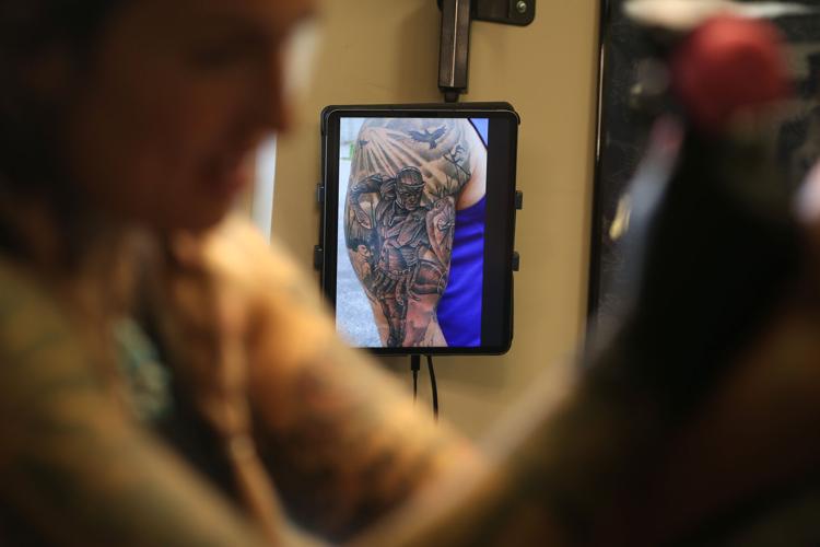 Tattoo artist, shop owner helps tell stories through skin and ink ...