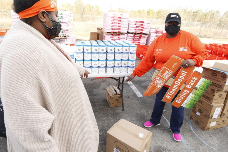 Home Depot Foundation delivers buckets of cleaning supplies to local