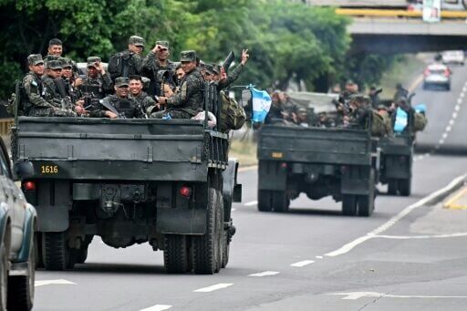 Soldiers escort trucks transporting ballots to be counted