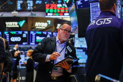 A trader works on the floorat the New York Stock Exchange (NYSE) in New York City