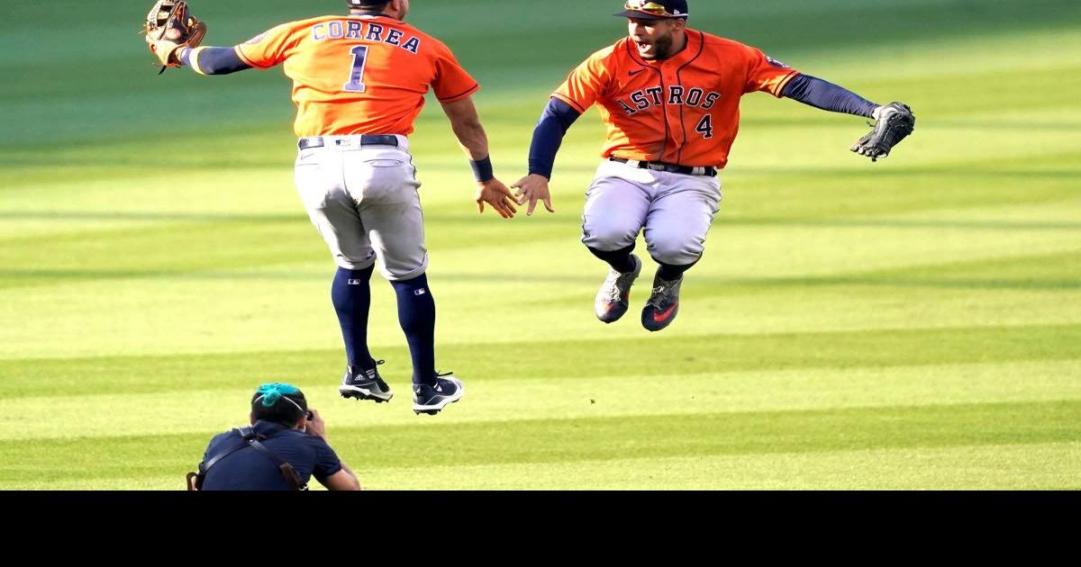 Houston Astros center fielder George Springer (4) celebrates his two-run  home run with Alex Bregman (2), Jose Altuve (27) and Carlos Correa in the  second inning against the Los Angeles Dodgers in