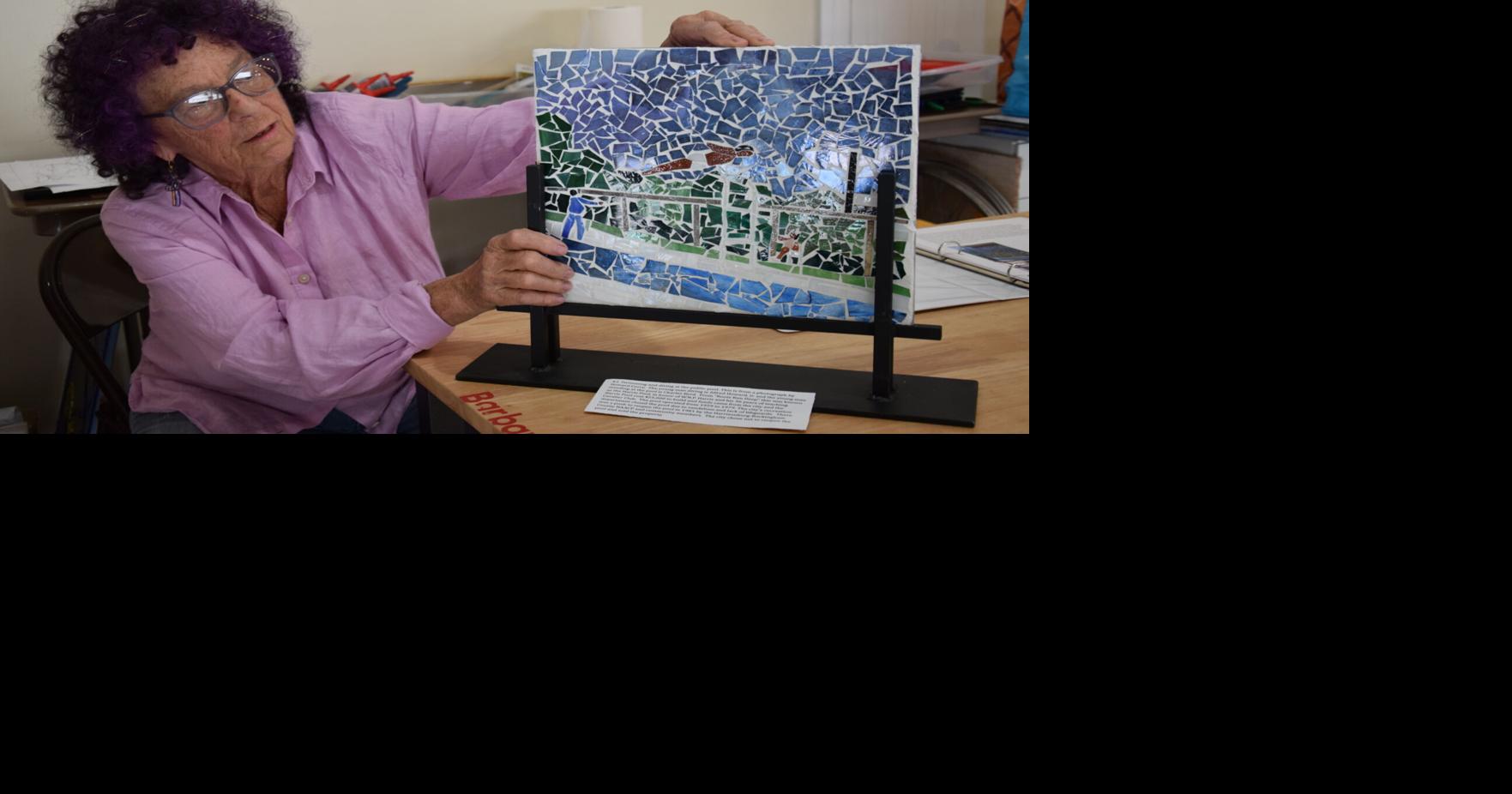Glass artist creating mosaics depicting historic Northeast Neighborhood ...