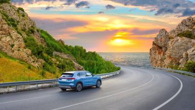 Car,Driving,On,Beautiful,Road,In,Colorful,Sunset,Landscape,In