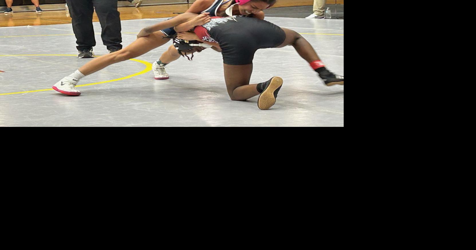 The Wildcats overcame a late 12-point deficit to win the dual match over the Wolves.