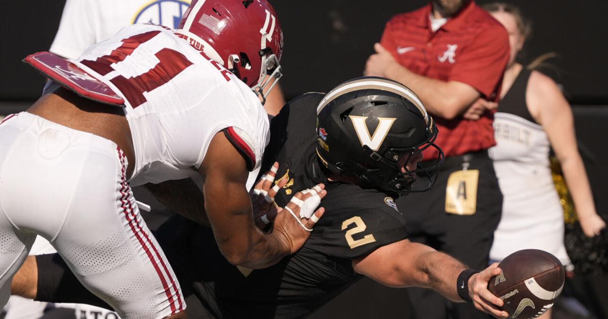 Vanderbilt’s football stadium in the distance, Outlook logo on a digital screen nearby.