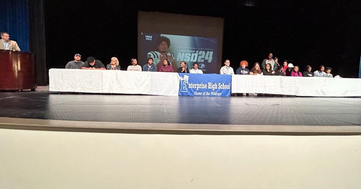 DothanEagle.com - Enterprise football players sign on the dotted line image