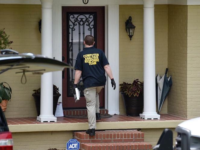 FBI agents search house on Whatley Drive